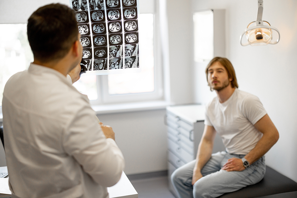 Man on medical appointment with urologist, examining an X-ray