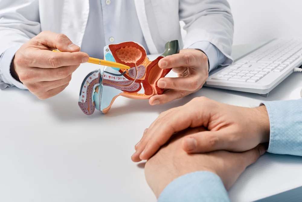 Male patient discussing prostate cancer treatment options with a consultant urologist at a clinic in Singapore