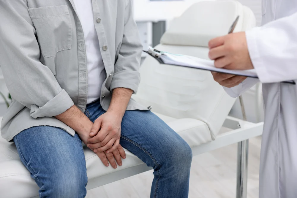 Male patient discussing urinary symptoms with a urology specialist during his first consultation