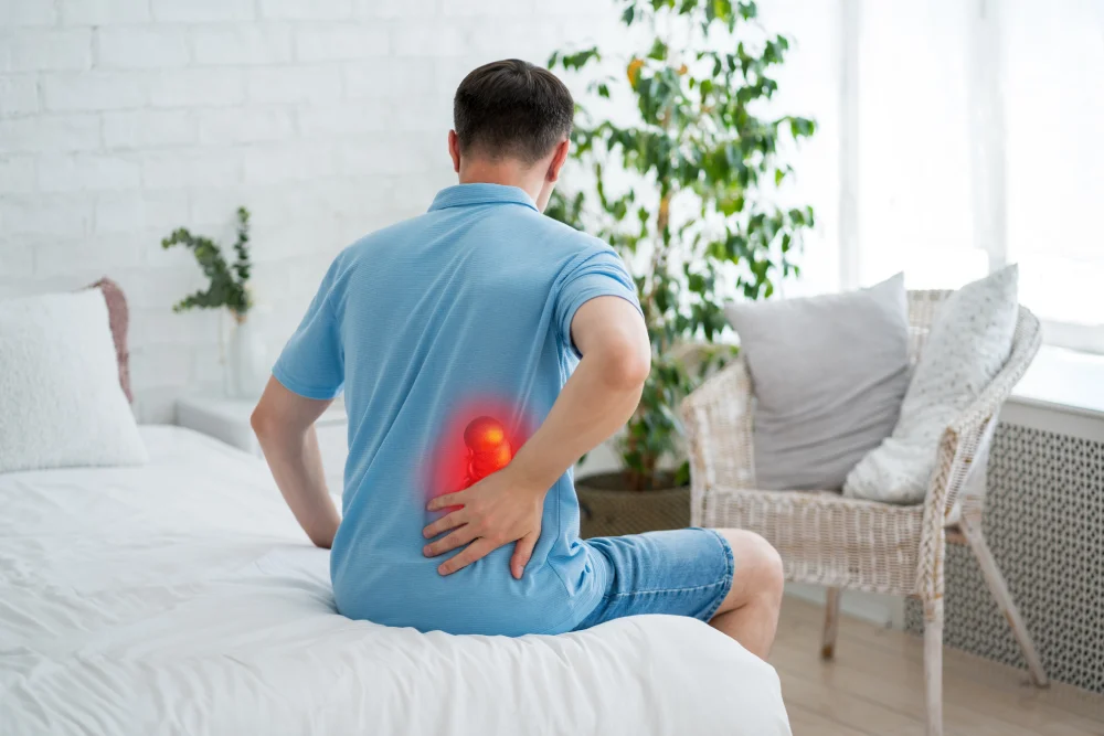 Male patient experiencing back pain due to a kidney condition, considering a urology surgical procedure